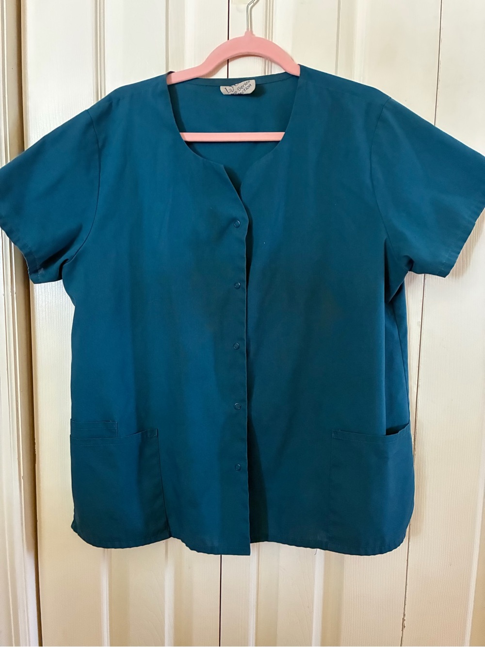 Dark teal women’s scrub jacket, short sleeve snap front V neck scrub jacket